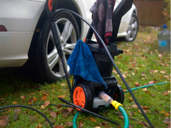 Electric Pressure Washer cleaning driveway with high-pressure jets