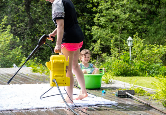 An electric pressure washer helps with backyard party cleaning.
