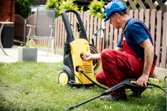 Inspecting water inlet pipe for blockages in pressure washer