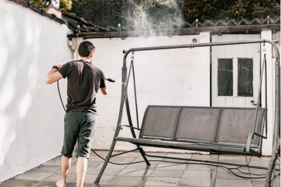 electric pressure washer cleaning playground slide surface