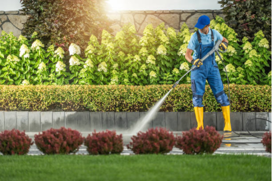 Electric pressure washer cleaning a patio efficiently